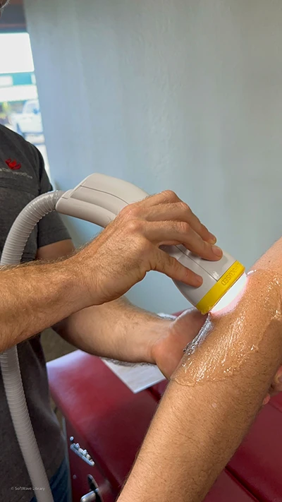 Chiropractic Phoenix AZ Shockwave Elbow Shockwave therapy being applied to a patient's elbow